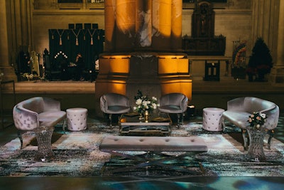 Tinsel Experiential Design created a moody, gothic masquerade-ball setting with dark pewter seating arrangements for IP Soft’s 2016 holiday party. The event took place at the Cathedral of St. John the Divine in New York in December.