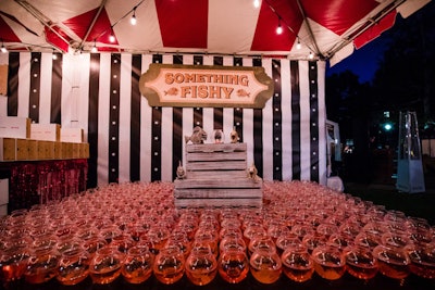 In keeping with the town-fair vibe, the party featured classic carnival games—with a creepy twist. For example, a fishbowl game featured fake dead fish floating in the bowls.