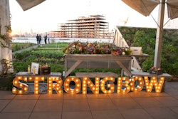 Branding for the event, which was designed in house, included a lighted marquee sign and displays with bottles of the new Artisanal Blend and apples in crates. The event also offered flowers for guests to take home.