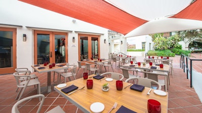 Tangata Restaurant; Adjoining raised patio that looks over green courtyard entrance to the Museum.