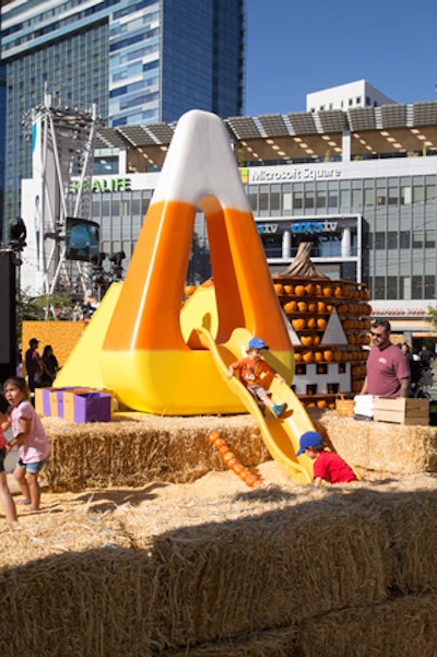 Children could slide through a larger-than-life piece of candy corn. Instead of a sandbox, they landed in a pile of corn kernels.