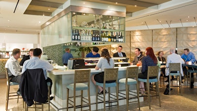 The Sea Grill at Rockefeller Center; Square shaped bar, serving sushi and hosting wine dinners.