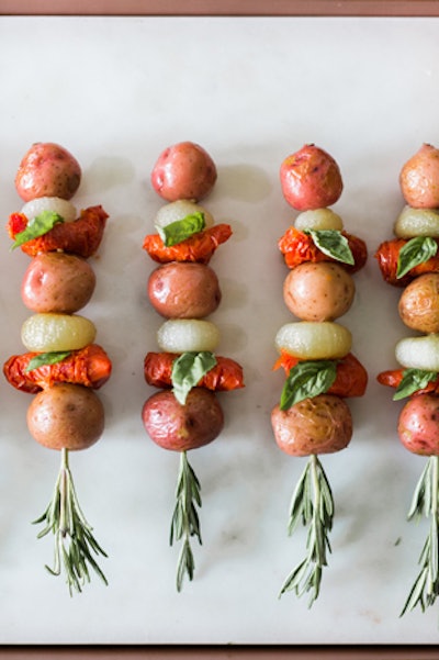 Rosemary potato salad skewers from Truffleberry Market in Chicago add a touch of fragrant greenery to the menu.
