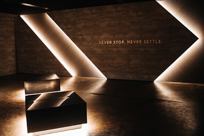 The waiting area featured the brand's tagline, 'Never stop. Never settle.'