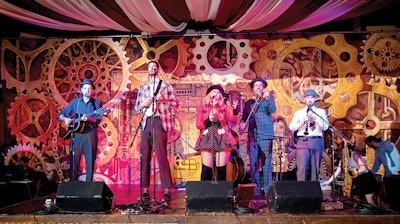 Our Steampunk backdrop setting the stage behind a talented band.