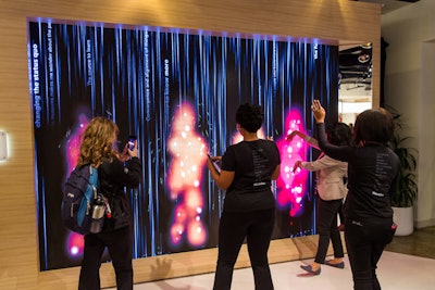 3M's Wonder Wall featured an interactive 'rainfall' element that allowed attendees to interrupt the falling digital water through their body movements, creating colorful figures on the screen.