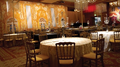 Our Gold Palace Interior backdrop adorning the wall of a reception hall at a wedding.