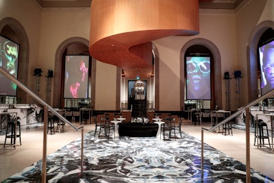 The cocktail area of the event featured the black and white color scheme on the floor, along with the use of silver foil as a nod to the Factory's signature decor. Fashion photography portraits from artist Mathew Guido also were displayed on four large screens.