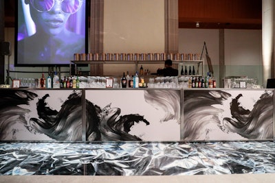 The black and white colors also traveled to the bar, which featured dramatic brushstrokes.