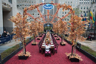 For its return to hosting a pre-Thanksgiving lunch at Rockefeller Center, Arnold Worldwide—OceanSpray's long-time brand experience agency—enlisted Tyger Productions to create a classic and festive setup whereby guests sat in a 20- by 60-foot cranberry bog filled with an estimated one million cranberries. The 12- by 36-foot arbor was covered in autumn foliage to create a cozy cocoon for diners that was simultaneously visible to passersby.