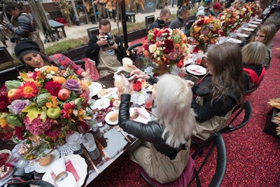 Tyger Productions designed an environment that elicited a sense of nostalgia, juxtaposing traditional elements with contemporary touches. Mismatched vintage china was paired with modern gold flatware, while cut crystal stemware was mixed with vintage embossed glass and new cranberry-red goblets.