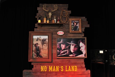 A wooden wall display featured props inspired by the series, artwork depicting the characters, and signage that went along with the theme of female power.
