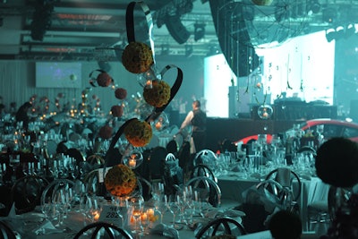 The gala dinner portion for the event, which took place in the hotel's grand ballroom, showcased a black and white tablescape and sculptural floral centerpieces created by Bayfront Floral.