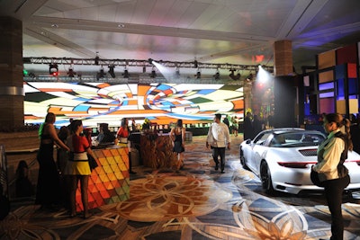 A reception area on the hotel's mezzanine featured a wall of Mondrian-inspired video art that served as a backdrop for the event's silent auction.