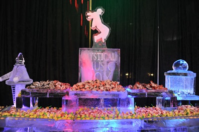 A raw seafood bar with stone crabs, lobster, and shrimp featured ice sculptures, including one that displayed the name of the theme. The sculptures were designed by the hotel.