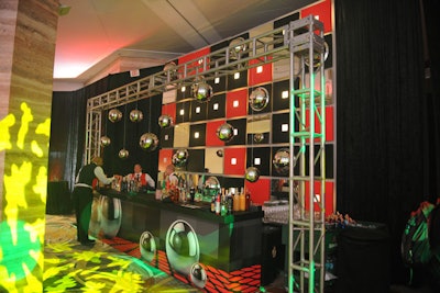 Another bar featured a wall of red, black, and white checkers, along with hanging silver spheres.