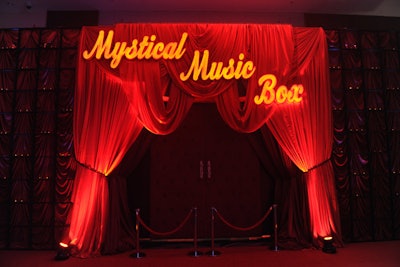 The title of the event's theme was featured on a theater-inspired wall.