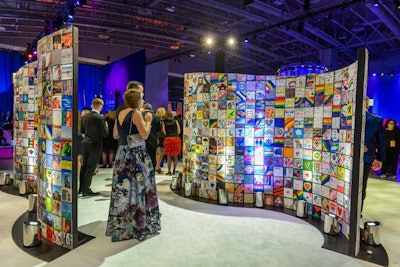 Guests admired a mosaic display of images representing love, acceptance, and other themes during the reception.