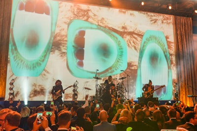 Joe Jonas’s band DNCE performed during the dinner in front of colorful video and graphics.