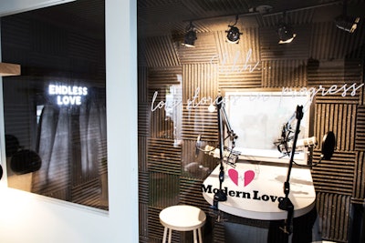 The recording studio featured Modern Love branding and neon signage. The custom studio was built for couples to tell their personal love stories.