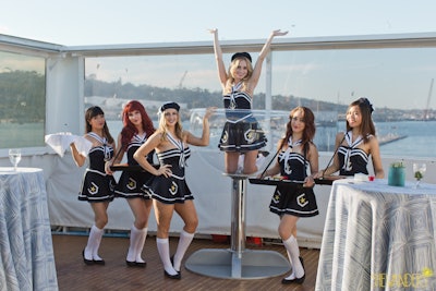 Our costumed servers and life-size champagne-glass model.