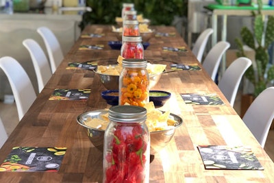 Six of the hottest peppers in the world are on display—and available to sample—in glass jars down the middle of the dining table.