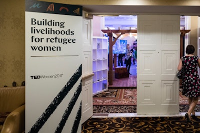 Inside the entrance to the ballroom, organizers played the trailer for 'Human Flow,' a new documentary about the global migrant crisis.