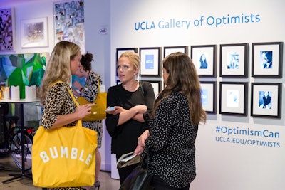 U.C.L.A. partnered with the festival as part of its U.C.L.A. Optimists initiative, which explores how the power of optimism can change the world. The university's onsite activation was an interactive gallery wall, which was designed by Fast Company art director Carly Stern and fabricated by Duggal Visual Solutions. Guests could flip through notable university alumni via iPads mounted on the wall.