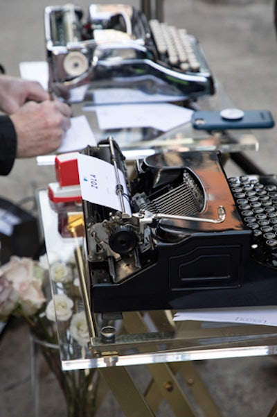 The Haiku Guys and Gals, a company that writes custom poetry on antique typewriters for guests at events, was onsite to turn participating couples' love stories into haikus on branded Zola cards.