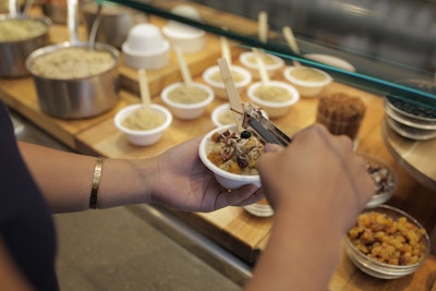 Wolfgang Puck Catering also offers a variety of energizing snack options with brain-boosting foods such as almonds, walnuts, and flax seeds. Options include a customizable trail-mix bar, a build-your-own parfait bar, and a build-your-own oatmeal bar (pictured).