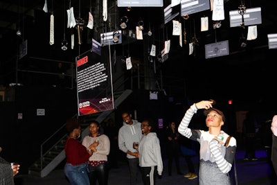 'Hunger,' an illuminated mobile art installation at the center of the space, showcased hanging desirable items meant to evoke guests's aspirations.