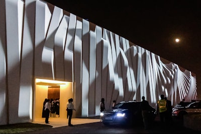At a wedding for Qatar’s royal family in November 2016, Megavision Arts transformed a 53,000-square-tent into a memorable, moving work of art. Crews built a 30- by 360-foot plywood wall in front of the tent and covered it in white muslin fabric to serve as the projection surface. The result was that as the guests drove up to the event, they saw a massive, undulating 3-D black-and-white animation accented with a custom musical score. Click here to watch a video