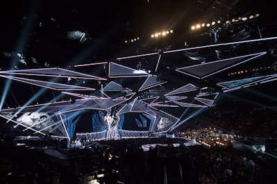 MTV created its most ambitious stage design yet for the 2017 Video Music Awards, held in Los Angeles in August. Stufish Entertainment Architects rigged 340,000 pounds of equipment to 560 individual points at the Forum. Six individual stages—including two main stages, a far stage, a “mosh” stage, and a central stage with a catwalk—allowed performers to connect with audience members. Overall, the reflective, metallic set used more than 8,200 feet of LED lines and 100,000 individual LEDs.