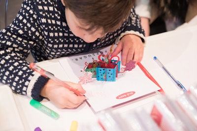 To go along with their gift boxes, guests could customize pop-up cards with glitter, stickers, and their own handwritten messages.