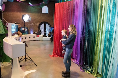 A GIF photo booth had a backdrop of the event's color palette in bright strips.