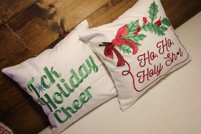 Cozy holiday pillows featured naughty messages.