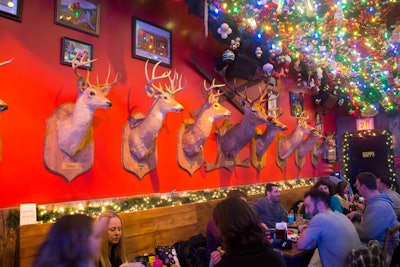 The heads of Santa’s reindeer, including Rudolph, were mounted on the wall.