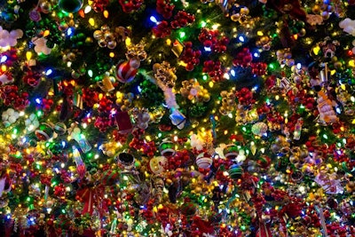 The bar’s ceiling featured over-the-top garland and decorations, including traditional ornaments, mixed with unusual additions like prescription pill bottles.