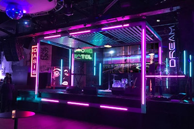 For a kickoff event for New York Comic Con in October, Clickspring Design transformed a nightclub into a futuristic world featuring a “cyberpunk, neon-noir” look meant to evoke Blade Runner 2049, one of the movies being promoted at the convention. Designers used reflective finishes, LED video displays, glowing neon, and materials such as corrugated polycarbonate to create an eye-catching stage design. The event was produced by CAA and ReedPop.