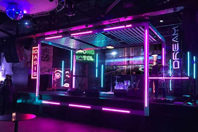 For a kickoff event for New York Comic Con in October, Clickspring Design transformed a nightclub into a futuristic world featuring a “cyberpunk, neon-noir” look meant to evoke Blade Runner 2049, one of the movies being promoted at the convention. Designers used reflective finishes, LED video displays, glowing neon, and materials such as corrugated polycarbonate to create an eye-catching stage design. The event was produced by CAA and ReedPop.