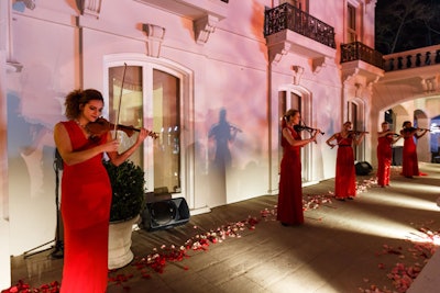 Hallmark hosted a Valentine’s Day-inspired event during the winter Television Critics Association tour in 2015. Red and pink rose petals lined the way from the cocktail tent to the dinner tent, and female violinists in long red satin gowns played classic songs such as 'Moon River,' 'Over the Rainbow,' and 'Fly Me to the Moon.'