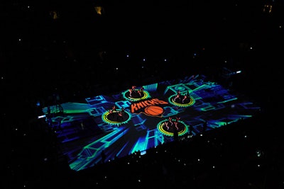 An increasing number of sports arenas are using on-court projection mapping to display player stats, accompany halftime entertainment, and increase fan engagement. For New York Rangers and New York Knicks games at Madison Square Garden, WorldStage uses 14 projectors, with each portion of the ice or court receiving 60,000 lumens. Lighting design by Arc3 Design and custom content by Batwin & Robin Productions complement the projections, creating a fully immersive environment inside the arena. Click here to watch a video