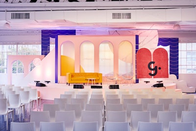 The second Girlboss Rally business conference was held in New York in November, bringing together more than 600 attendees and 30 speakers to discuss the meaning of success. The event featured a feminine, cheery color palette of pinks, reds, oranges, and whites. The stage design by the Gathery offered a simple—yet stylish—backdrop of curved shapes that picked up the same colors and styles as the rest of the conference.