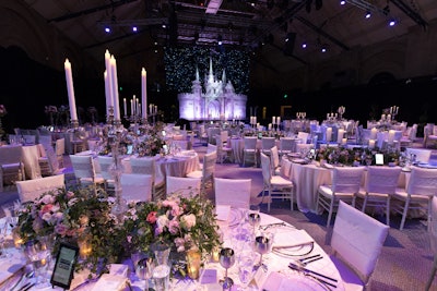 Enchanted garden embraces guests with rose and twining ivy table scapes