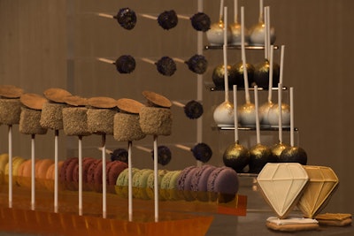 The Diamond Jubilee-theme dessert selection includes peanut butter cake pops covered in coconut, s’mores sticks, rocky road mini cupcakes, New York cheesecake bites, diamond celebration cookies, French macarons, and more.