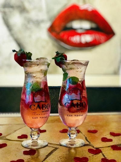 Cabo Wabo Cantina in Las Vegas is offering a cocktail called “Kiss on the Lips.” The drink is made with Cruzan strawberry rum, Passoa liquor, soda water, fresh strawberries, and mint leaves, and costs $13.