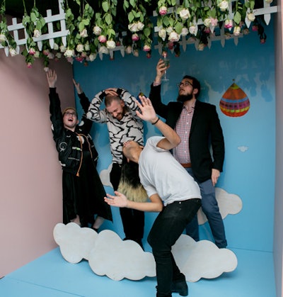 The 'DTFall Head Over Heels' photo booth made guests appear as if they were falling from the sky into a bed of roses. The installation was built by City Iris.