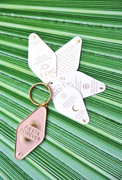 This custom keychain itinerary was included in the guests’ pre-arrival package. Designed by Gifts for the Good Life, there were two versions: pink for women and white for men.