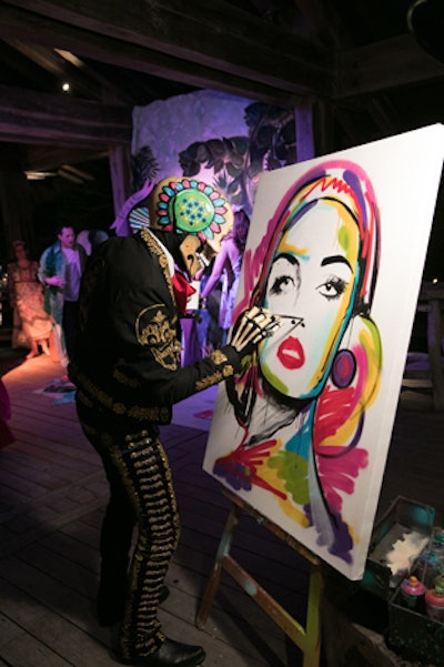 During the dessert party, an artist created a colorful painting on site.