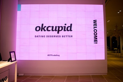 A pink LED wall welcomed guests to the event.